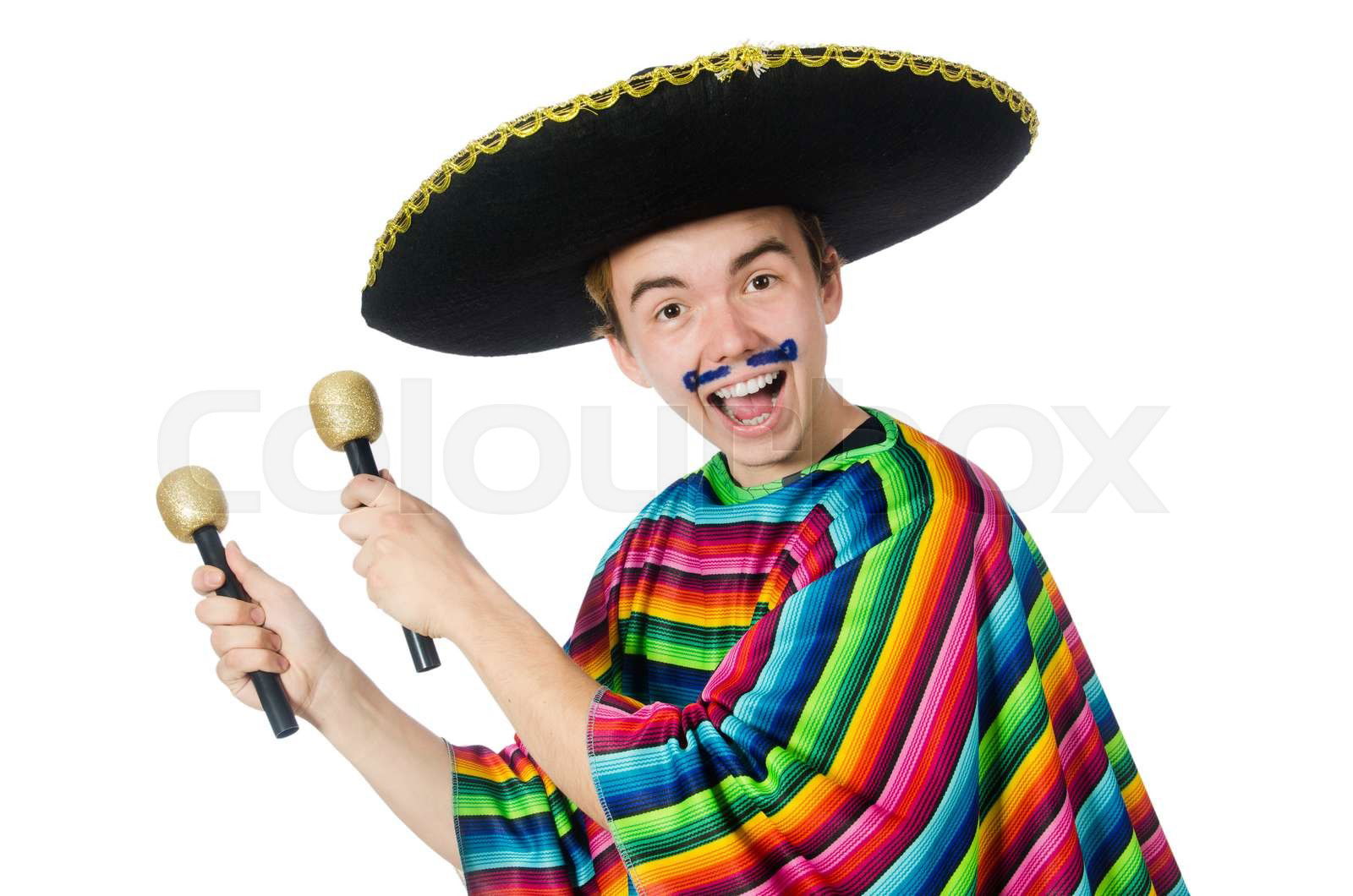 Funny young mexican shaking maracas isolated on white Colourbox