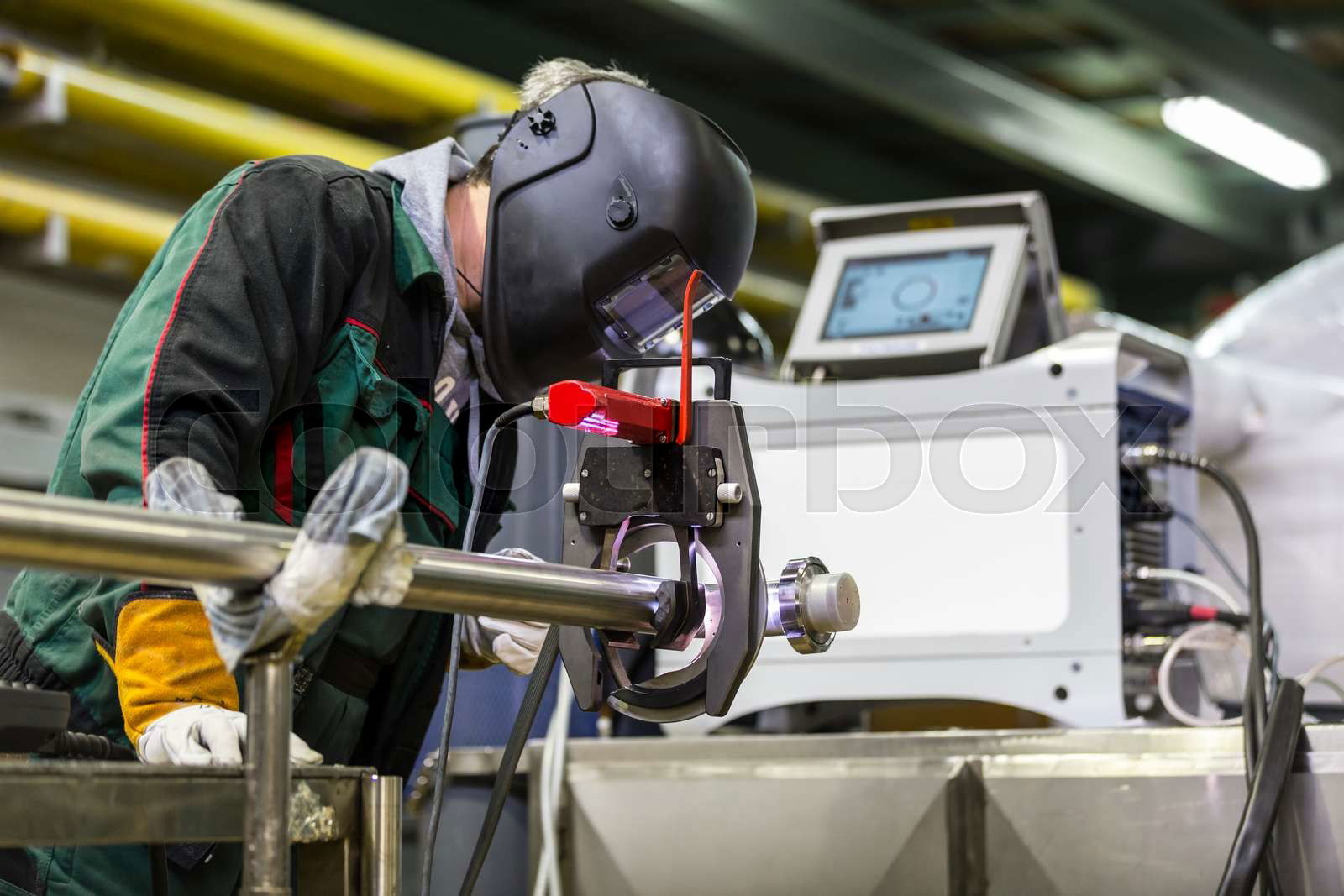 Industrial operator setting computer controlled process of Colourbox