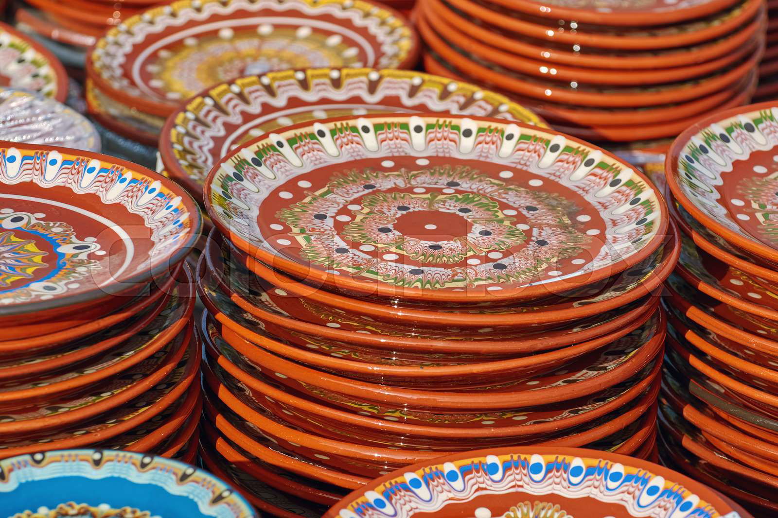 A Lot of Earthenware Crockery on the Pottery Market Colourbox