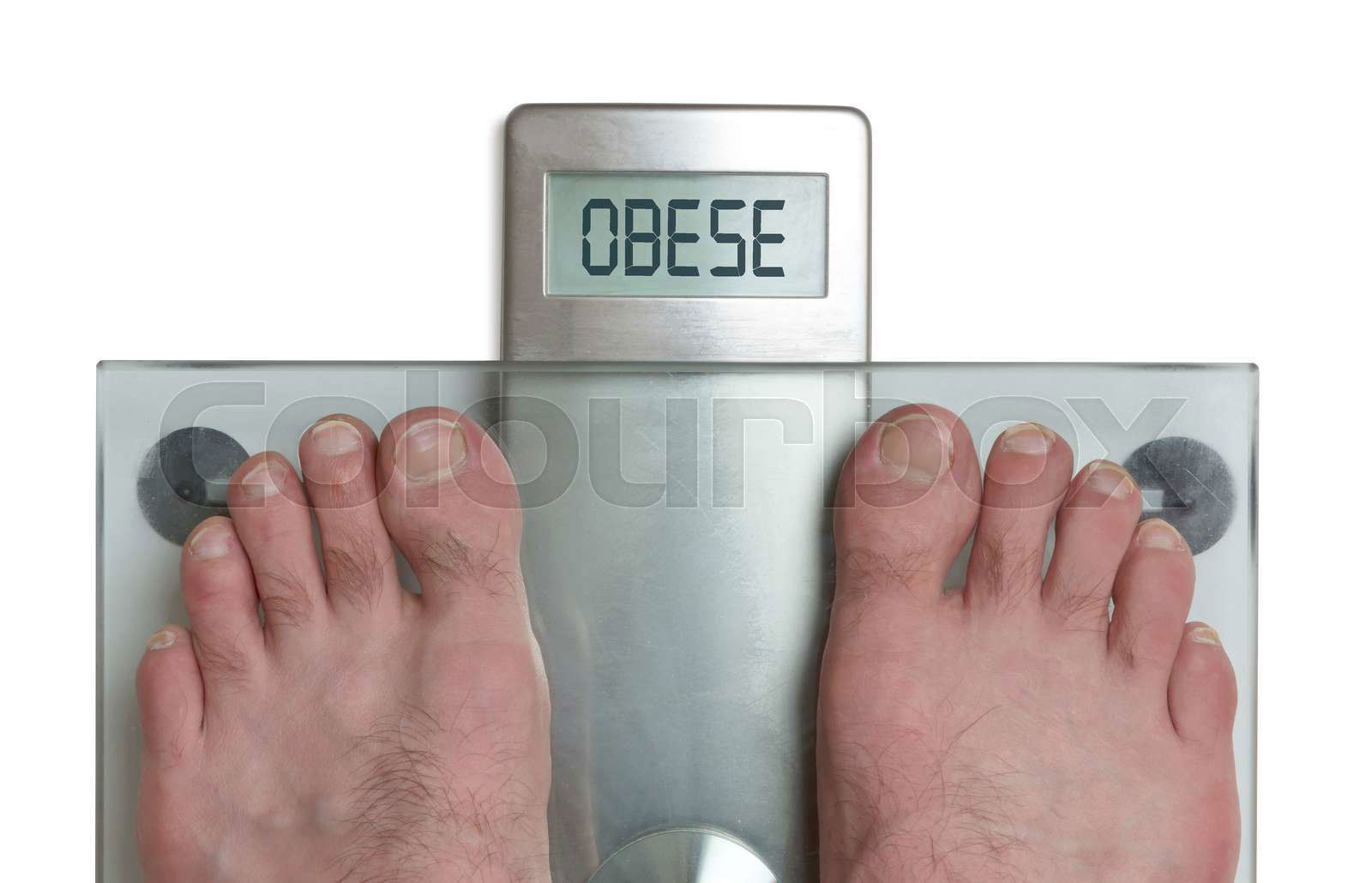 Closeup of man s feet on weight scale Obese Colourbox