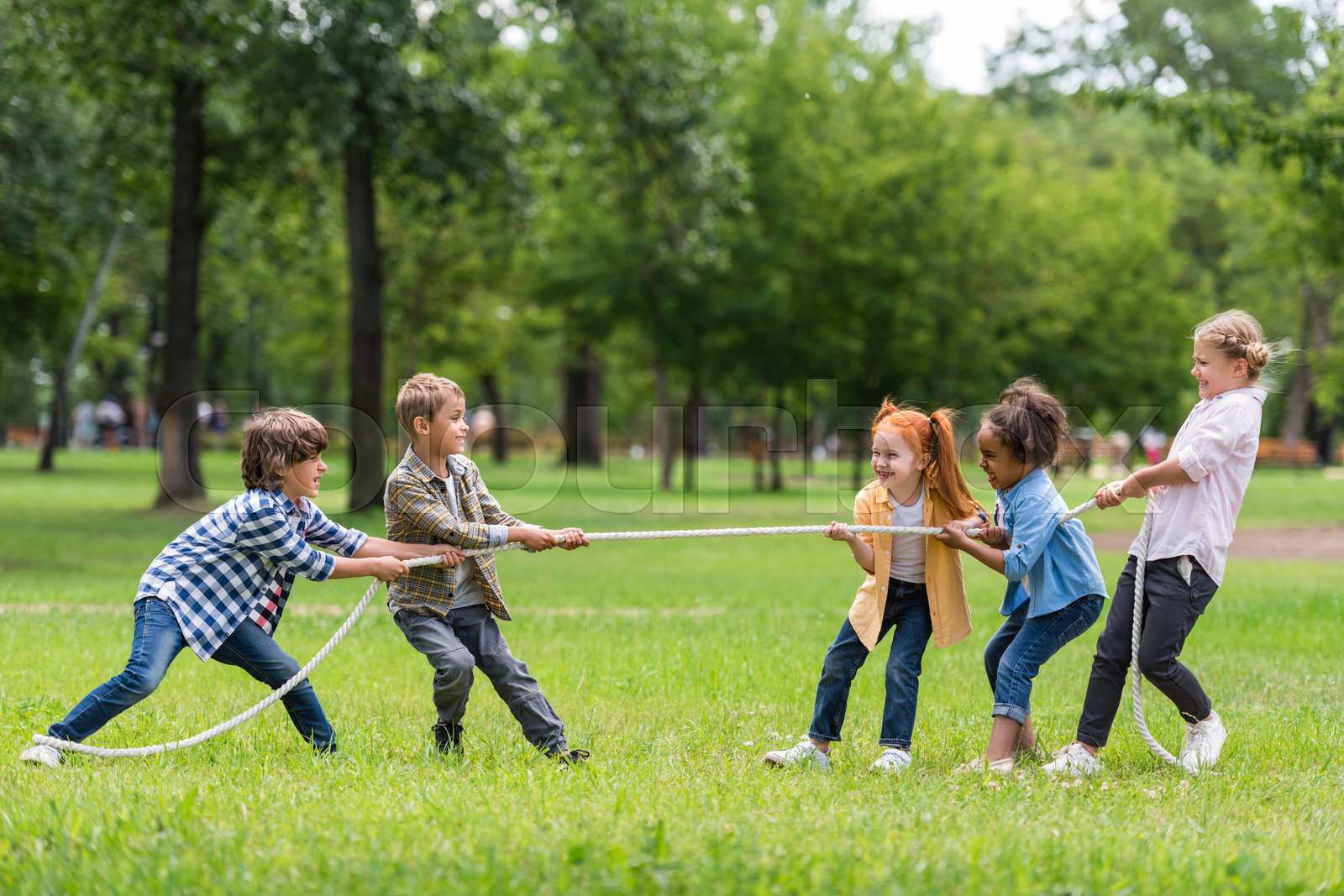 Two girls play tug of war kids sport isolated concept Colourbox