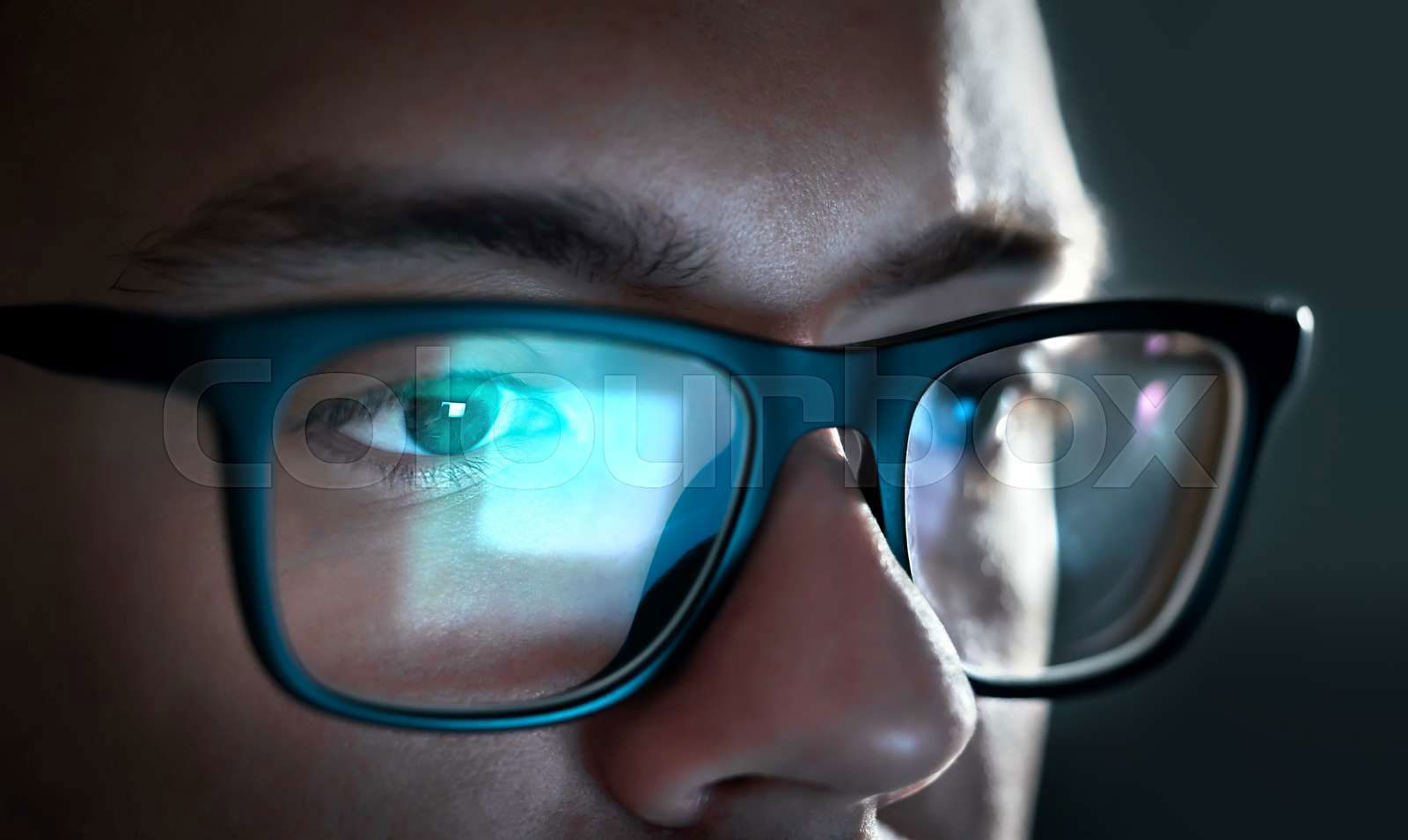 Glasses with light reflected from computer or smartphone scr Colourbox