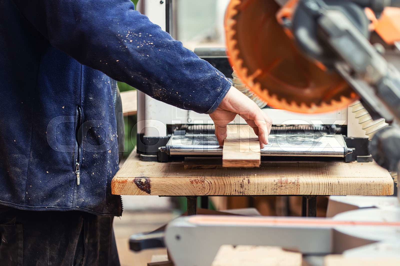 Craftsman woodworking at carpentry with lots of modern