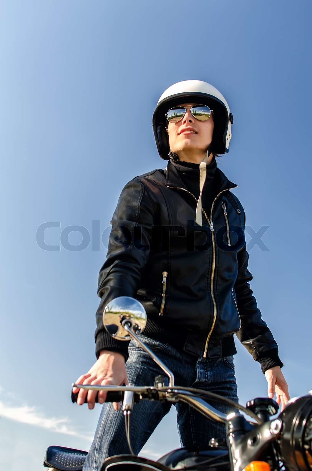 Motorcycle cop in a helmet and goggles Colourbox