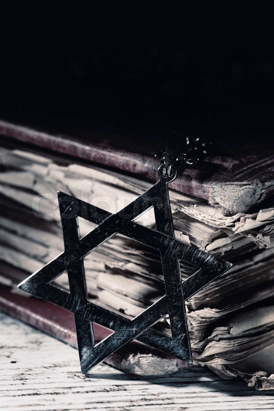 Closeup of an old and rusty pendant in the shape of the star Colourbox