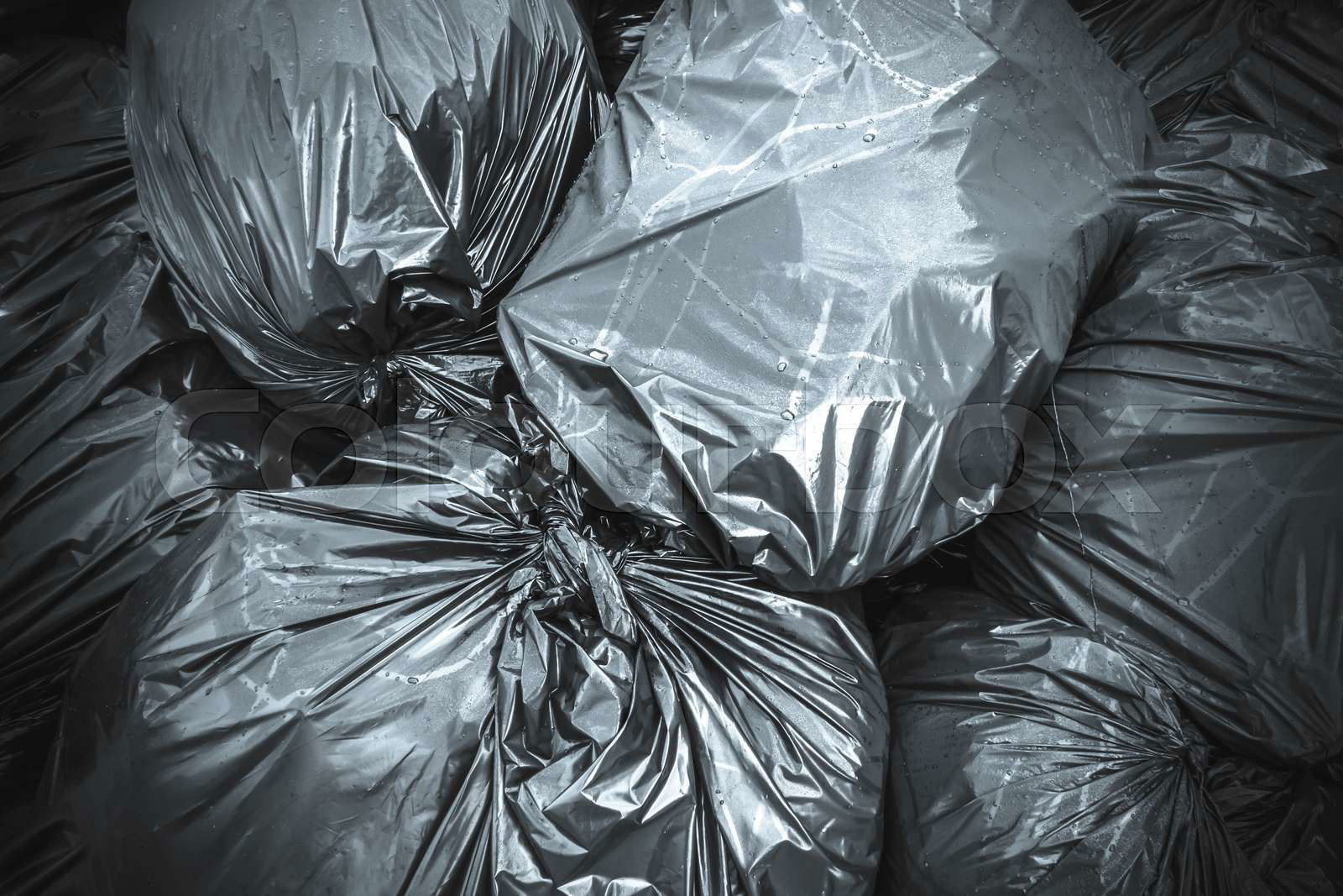 Garbage bags. Waste black garbage bags plastic pile stack. Colourbox