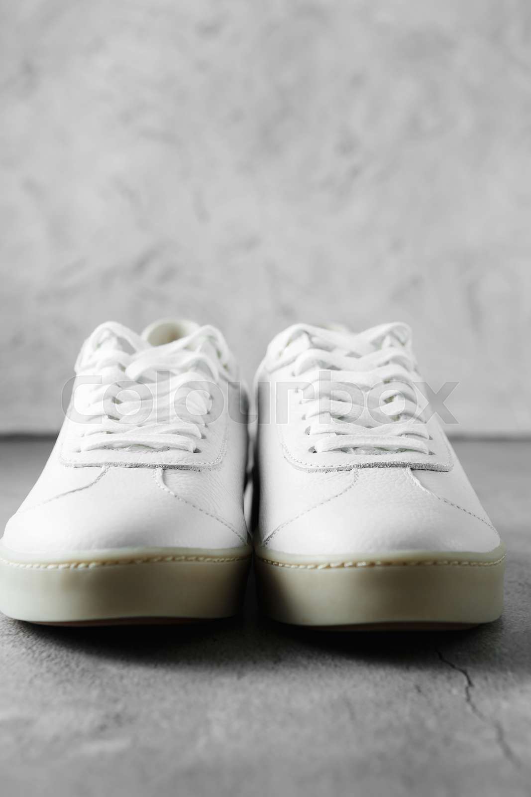 White plimsolls made of tumbled leather matching laces fabric lining and lightweight platform soles. Spring collection