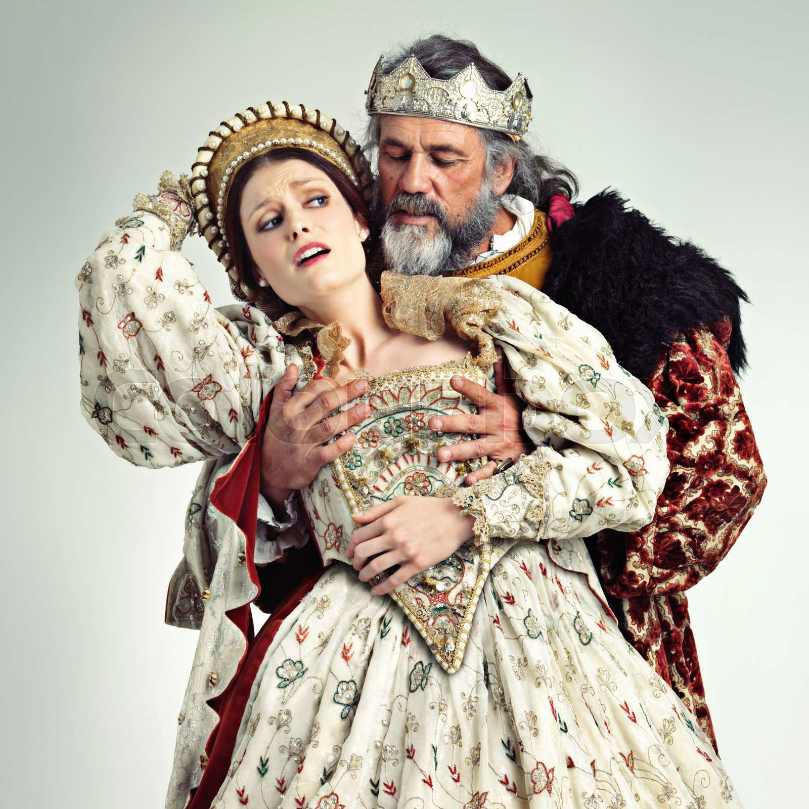 Theater king and queen in costume with violence in in crown Colourbox