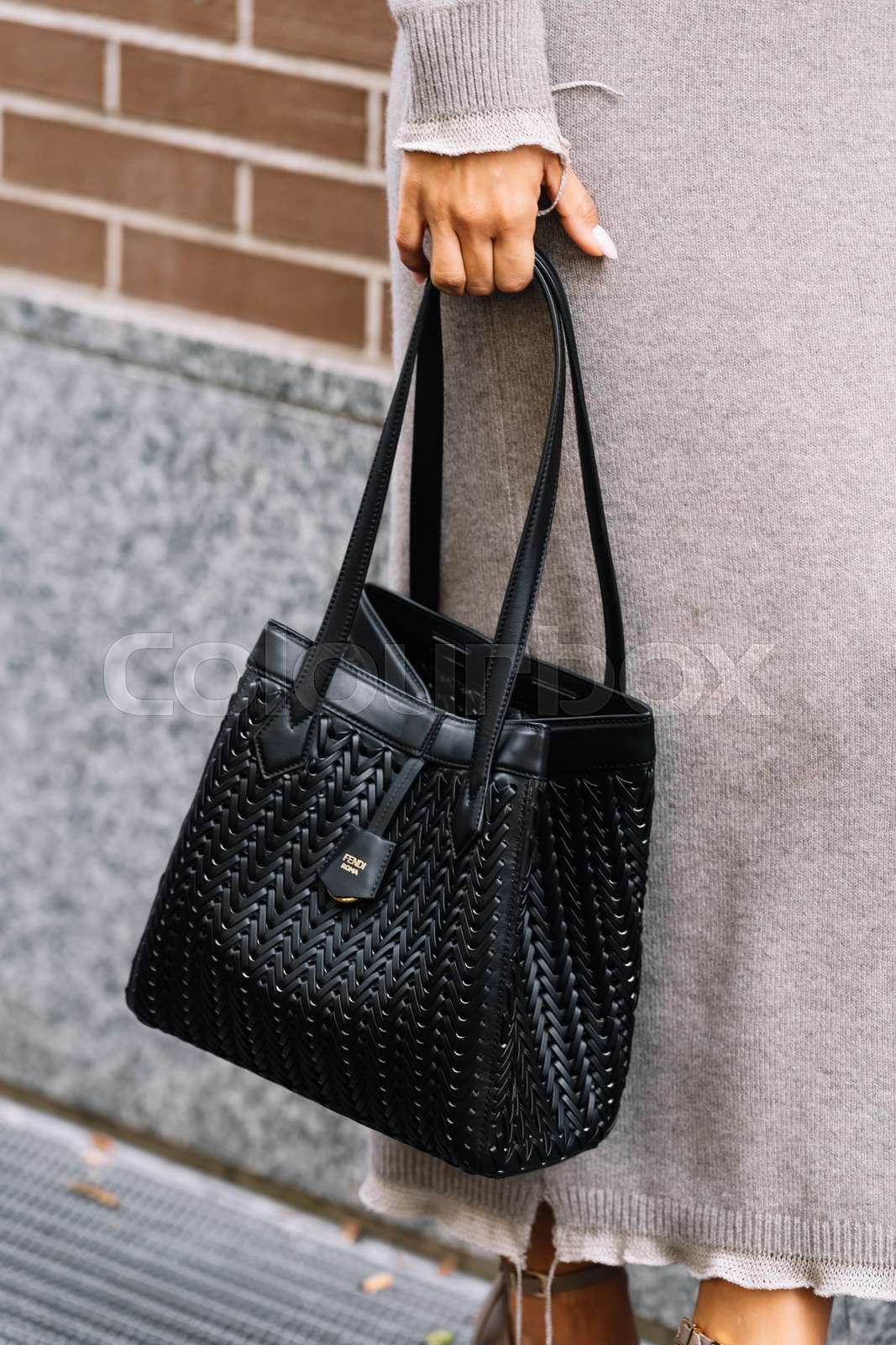 Milan, Italy - September 20, 2023: fashioner wearing Fendi O
