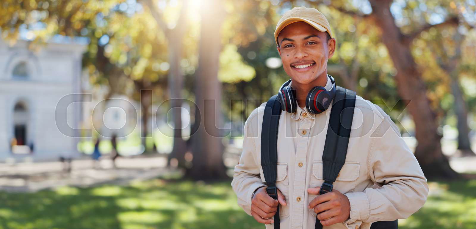Travel man and park portrait on college campus in New York Colourbox