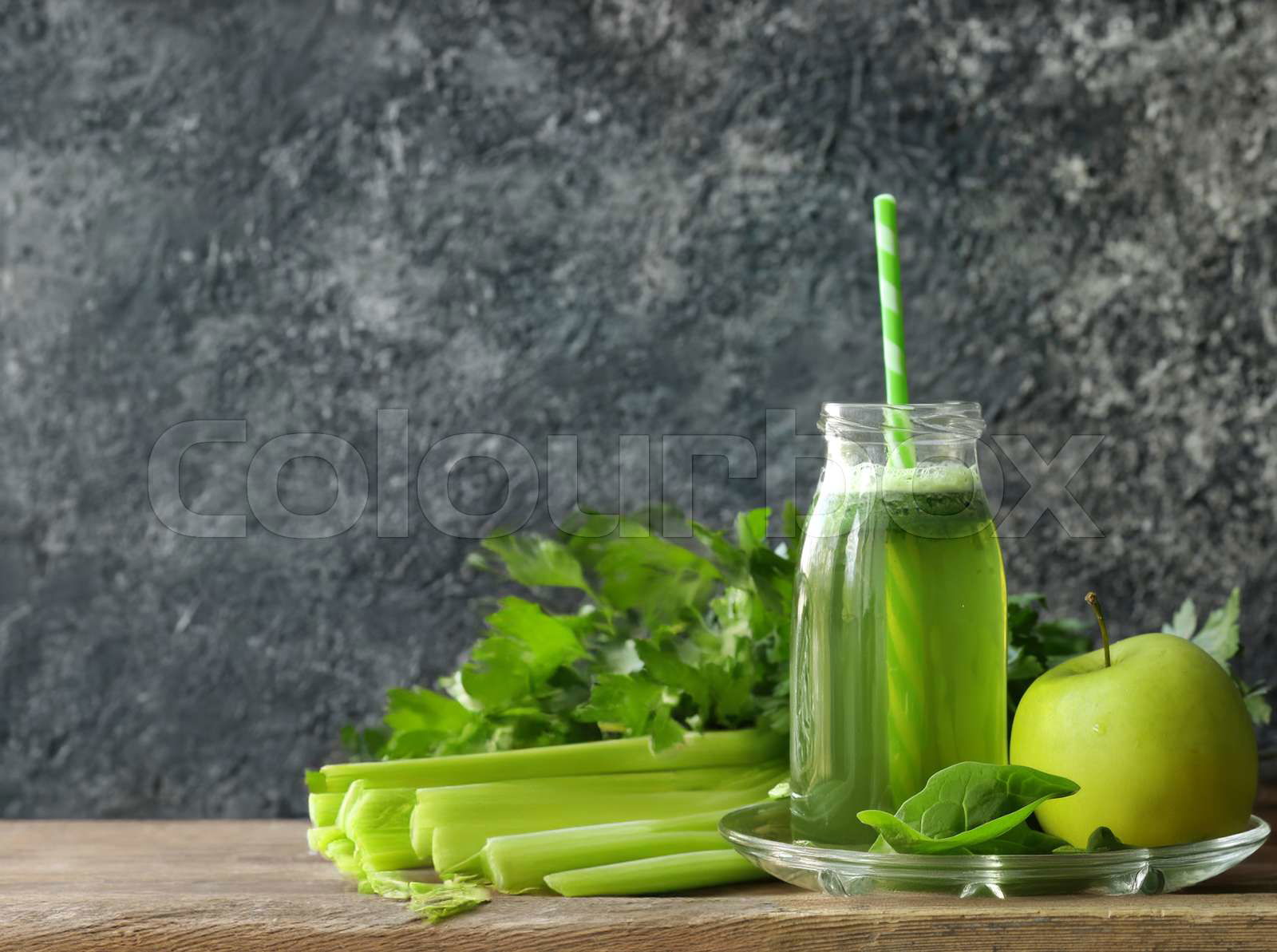 Apple spinach and celery smoothie in a bottle Colourbox