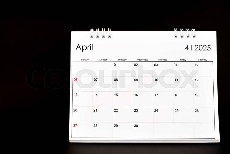 Desk calendar for february 2025. desktop calendar on a black | colourbox