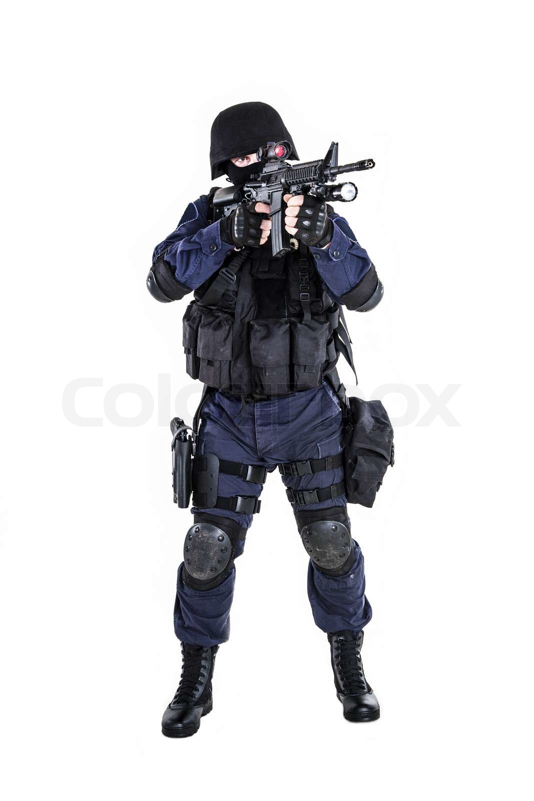 Special weapons and tactics (SWAT) team officer with his gun